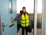 Lifeline employee at the front door of a resident